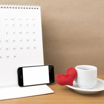 coffee,phone,calendar and heart on wood table background