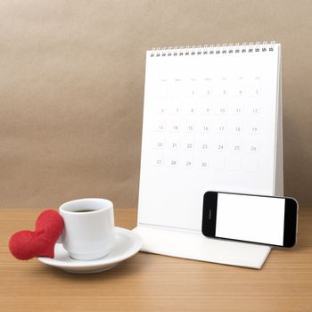 coffee,phone,calendar and heart on wood table background