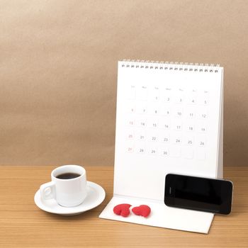 coffee,phone,calendar and heart on wood table background