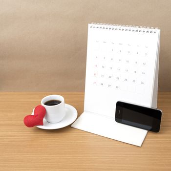 coffee,phone,calendar and heart on wood table background