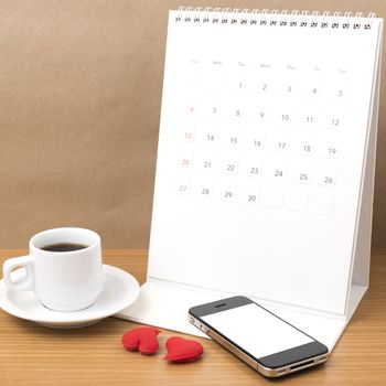 coffee,phone,calendar and heart on wood table background