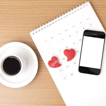 coffee,phone,calendar and heart on wood table background