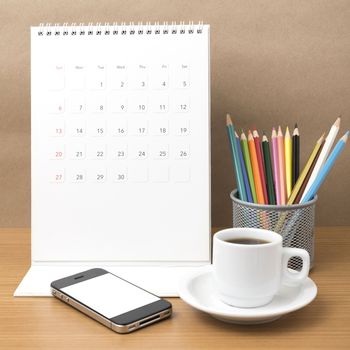 coffee,phone,calendar and color pencil on wood table background