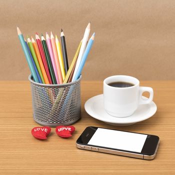 coffee,phone,color pencil and heart on wood table background