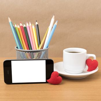 coffee,phone,color pencil and heart on wood table background