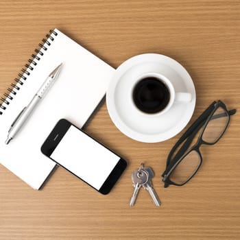 coffee,phone,notepad,eyeglasses and key on wood table background