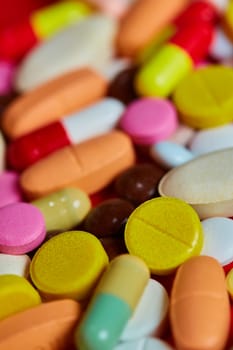 Close up of many colorful pills. Top view with copy space. Medicine concept. Shallow dof