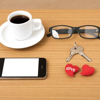 coffee,phone,eyeglasses and key on wood table background