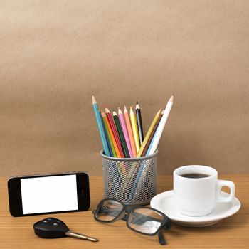 coffee,phone,eyeglasses,color pencil and car key on wood table background