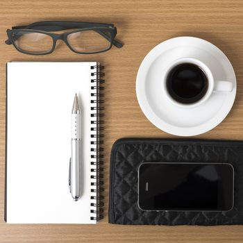 coffee,phone,eyeglasses,notepad and wallet on wood table background