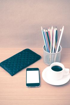 coffee,phone,wallet and color pencil on wood table background vintage style