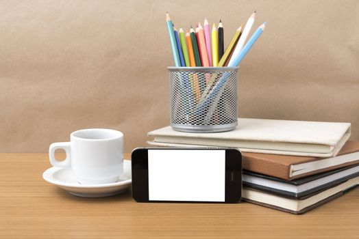 coffee,phone,stack of book and color pencil on wood table background