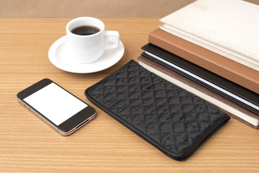 coffee,phone,stack of book and wallet on wood table background