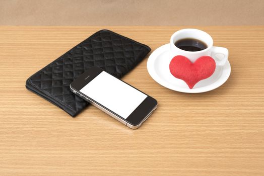 coffee,phone,wallet and heart on wood table background