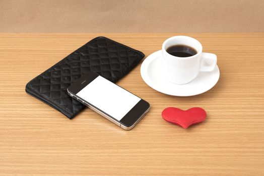 coffee,phone,wallet and heart on wood table background