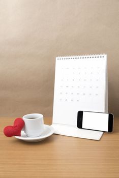 coffee,phone,calendar and heart on wood table background