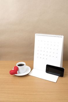 coffee,phone,calendar and heart on wood table background