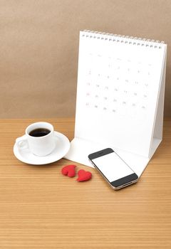 coffee,phone,calendar and heart on wood table background