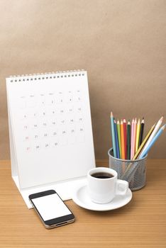 coffee,phone,calendar and color pencil on wood table background