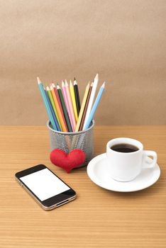 coffee,phone,color pencil and heart on wood table background