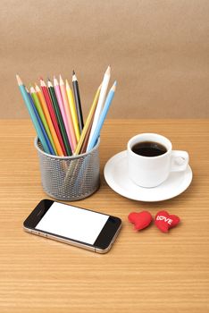 coffee,phone,color pencil and heart on wood table background