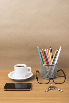 coffee,phone,eyeglasses,color pencil and key on wood table background