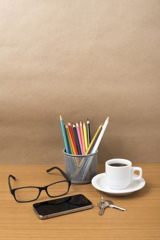 coffee,phone,eyeglasses,color pencil and key on wood table background