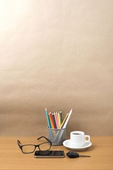 coffee,phone,eyeglasses,color pencil and car key on wood table background