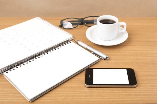 coffee,phone,eyeglasses,notepad and canlendar on wood table background