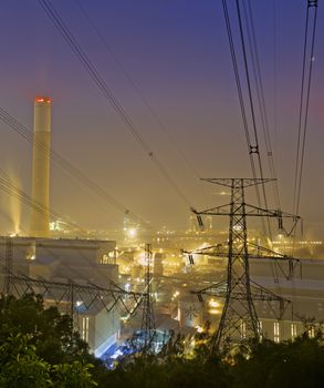 power station at night with smoke , hong kong
