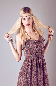 Hippie boho woman happy smiling. Beauty young playful positive blonde, long hair, ethnic accessories relax, having fun. Floral sundress, romantic style. Attractive loving girl. Unusual creative,people