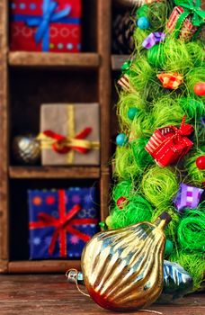 old Soviet glass Christmas toy on the background of symbolic trees