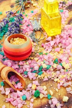 Different sea salt for baths and spas with branches of fragrant lavender.