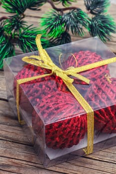Plastic box with Christmas balls and Christmas tree.