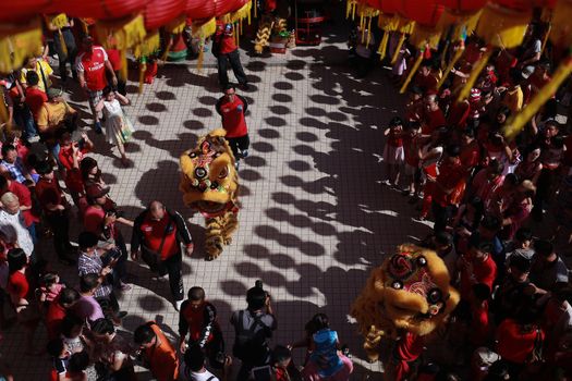 MALAYSIA, Kuala Lumpur: People gather around to watch the Lion dance, a traditional Chinese dance, at Thean Hou Temple on the first day of the Lunar New Year in Kuala Lumpur's popular Chinatown area on February 8, 2016. Some 25 percent of Malaysia's 29 million people are ethnic Chinese and celebrate the Lunar New Year, this year marking the Year of the Monkey.