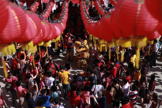 MALAYSIA, Kuala Lumpur: People gather around to watch the Lion dance, a traditional Chinese dance, at Thean Hou Temple on the first day of the Lunar New Year in Kuala Lumpur's popular Chinatown area on February 8, 2016. Some 25 percent of Malaysia's 29 million people are ethnic Chinese and celebrate the Lunar New Year, this year marking the Year of the Monkey.