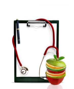 Healthy concept with stethoscope and slice of fruits in front of a clip board