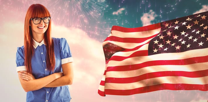 Composite image of gorgeous smiling red haired hipster beside american flag