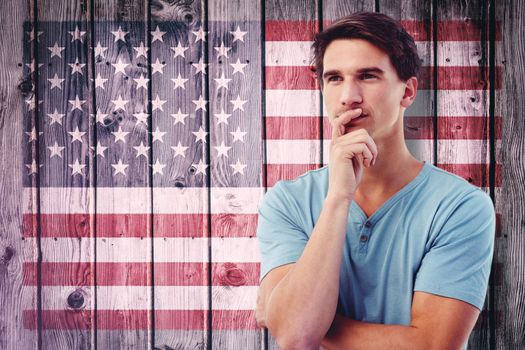 Handsome man thinking against composite image of usa national flag