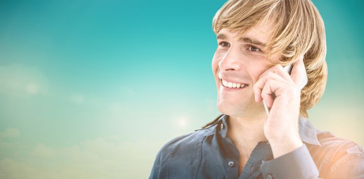 Hipster businessman talking on the phone against blue green background