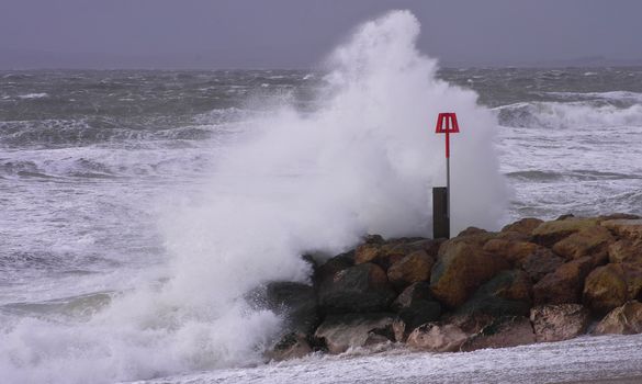 UK, Dorset: Waves crash on the south coast near Dorset as Storm Imogen batters the UK with winds reaching up to 80mph on February 8, 2016. With the UK on amber alert, gale-force winds and heavy rainfall have caused disruption to local train and ferry services. A 64-year-old inspector from the Royal Society for the Prevention of Cruelty to Animals reportedly went missing Sunday.