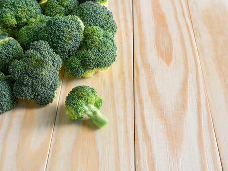 Fresh green broccoli on the wooden background