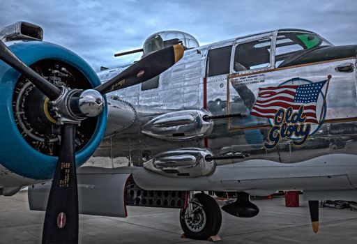 Redding, California, USA- September 28, 2014: A WWII era b-25 Mitchell bomber sits on display at an airshow in northern California and showcases it's 50 calibre machine guns and highly polished skin.