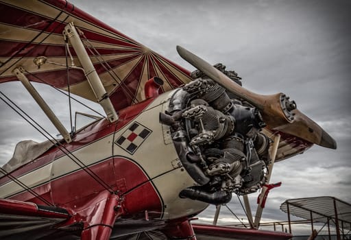 Redding, California, USA- September 28, 2014: A high performance stunt biplane and its engine are on display at an airshow in Northern California.