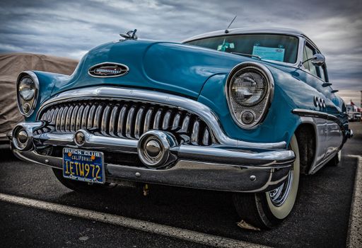 Redding, California, USA-September 28, 2014: A restored 1950's era Buick Skylark is on display at a car show in Redding and shows off it's unique chrome grill and blue paint.