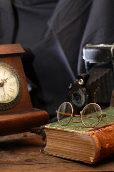 Vintage still life with various old things on dark cloth background