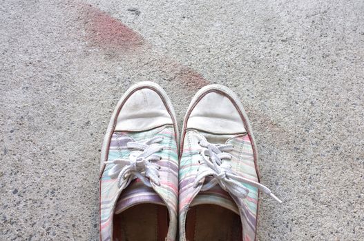 Colourful sneakers on cement floor