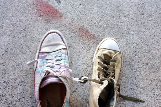 Colourful sneakers on cement floor