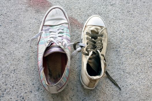Colourful sneakers on cement floor