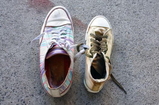 Colourful sneakers on cement floor